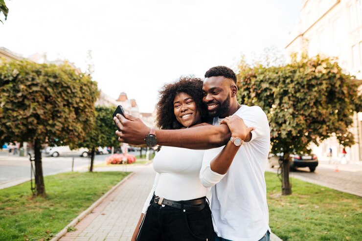 african couple taking a selfie