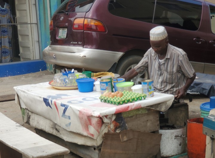 Roadside mallam preparing food you can eat on a budget