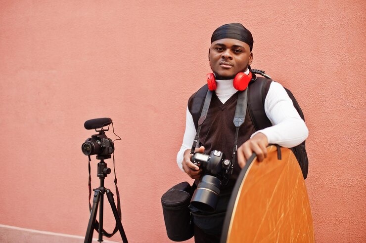 Picture showing young photographer with his tools