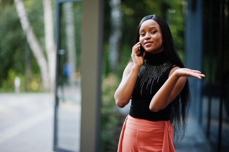 picture showing a lady discussing on a phone call her reservations about living on the island 