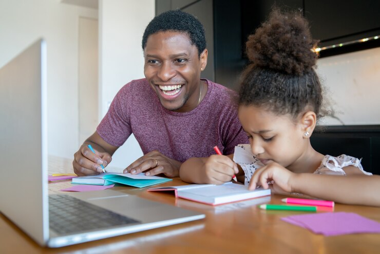 picture showing father learning as he's teaching his daughter