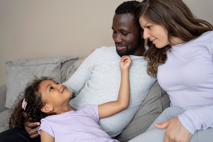 picture showing parents and their curious child having a conversation on  Sex Education