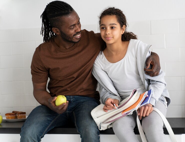 picture showing father and daughter having a conversation on  Sex Education