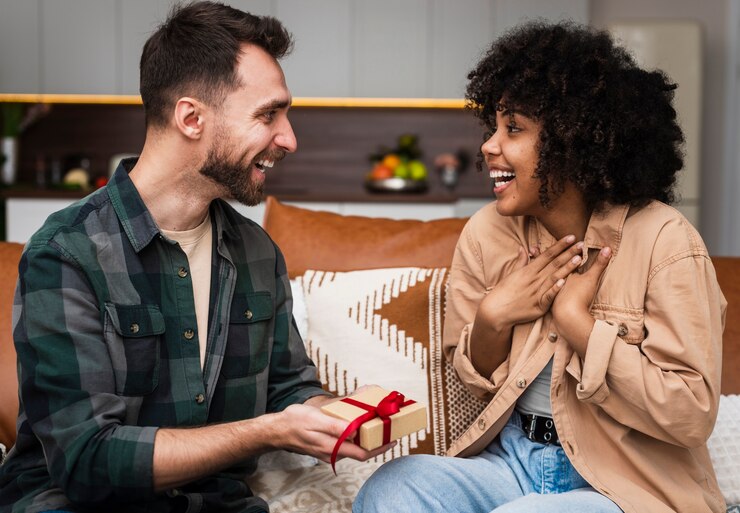 picture showing a man giving his partner a gift 