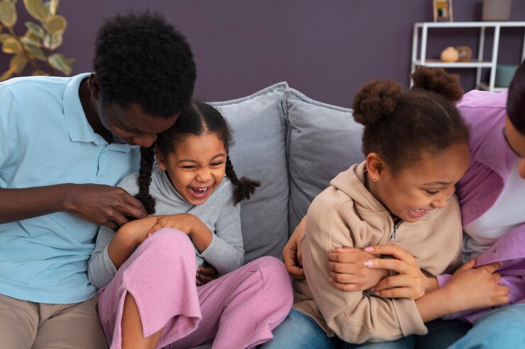 picture showing parents and their children playing indoors