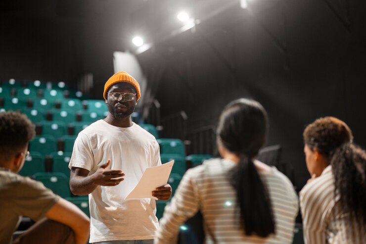 Picture showing a young man engaging  his audience