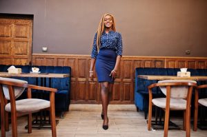 Picture showing young stylish lady in an office