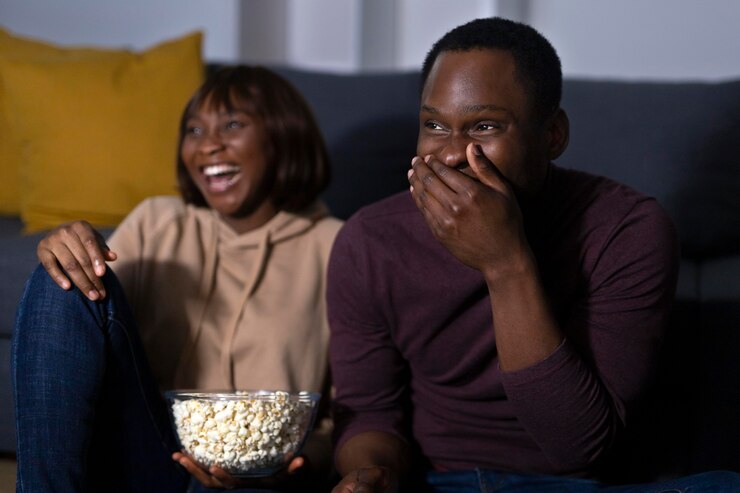 picture showing a couple enjoying a movie night at home 