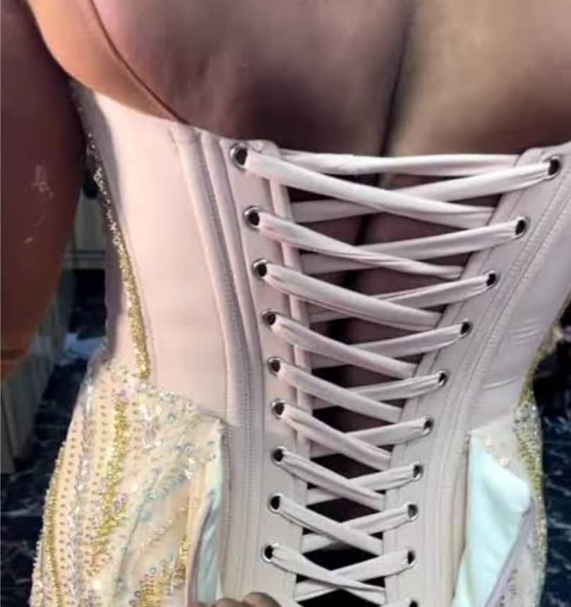 picture showing a woman wearing really tight corset to make a fashion statement