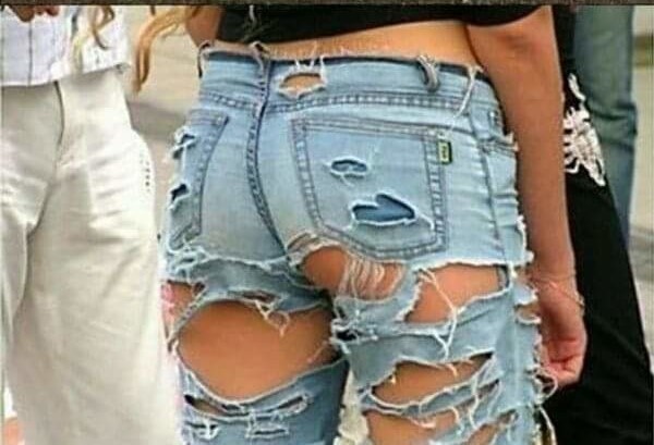 picture showing a woman wearing ripped jeans to make a fashion statement