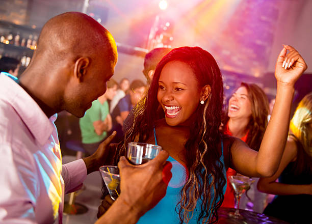 couple dancing in the vip section of a club as a prerequisite for fake living