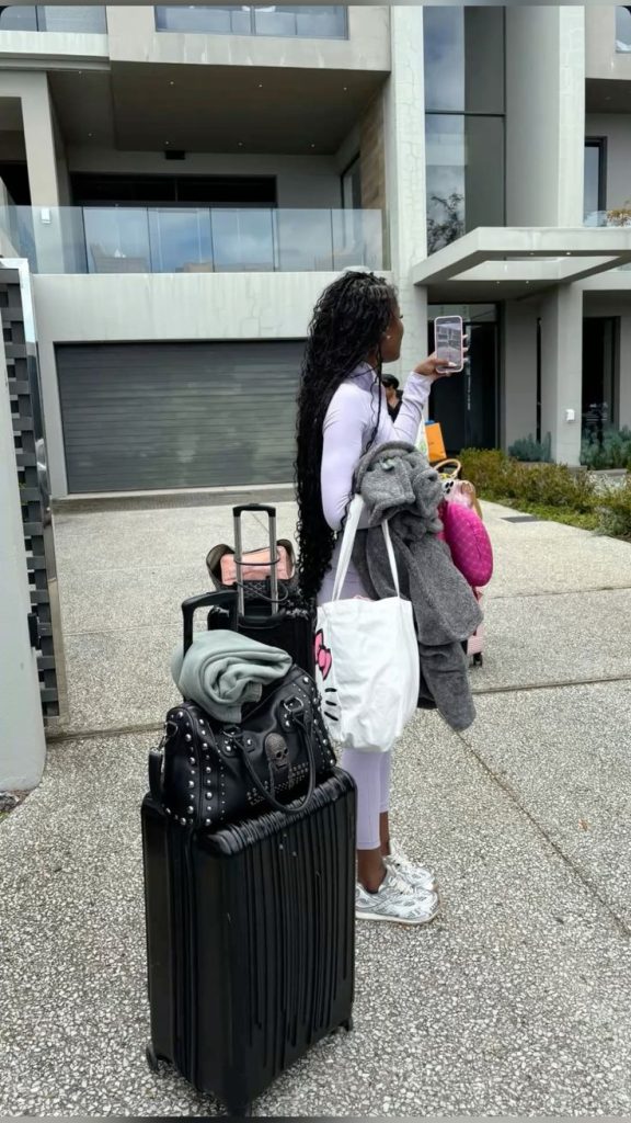 Woman and her luggage for a group trip