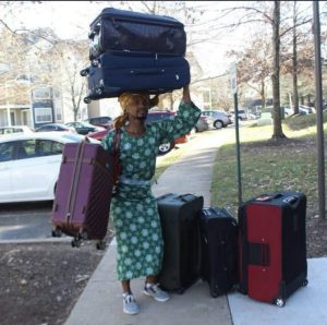 Nigerian with overpacked boxes